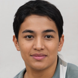 Joyful asian young-adult male with short  black hair and brown eyes