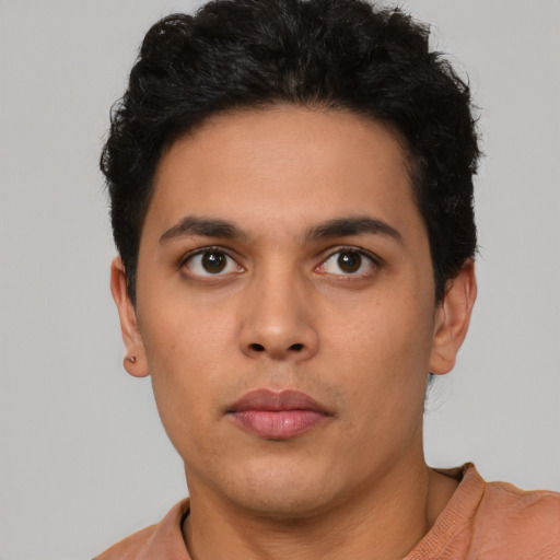 Neutral latino young-adult male with short  brown hair and brown eyes