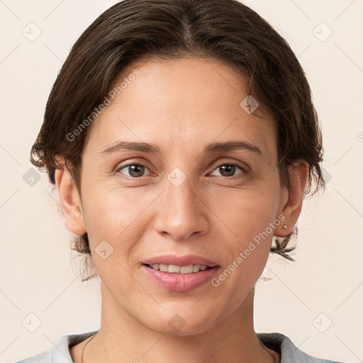 Joyful white adult female with medium  brown hair and grey eyes