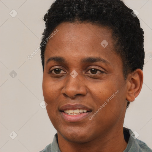 Joyful black young-adult male with short  black hair and brown eyes