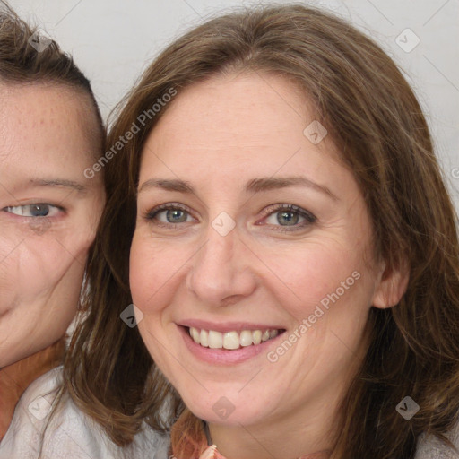 Joyful white adult female with medium  brown hair and grey eyes