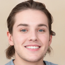 Joyful white young-adult male with medium  brown hair and grey eyes