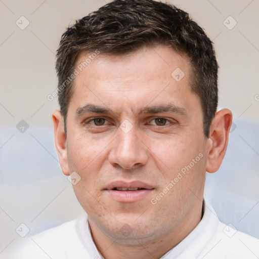 Joyful white adult male with short  brown hair and brown eyes