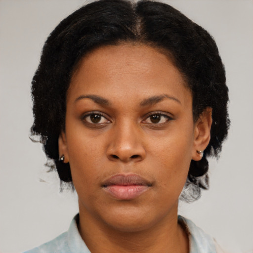 Neutral black young-adult female with short  black hair and brown eyes