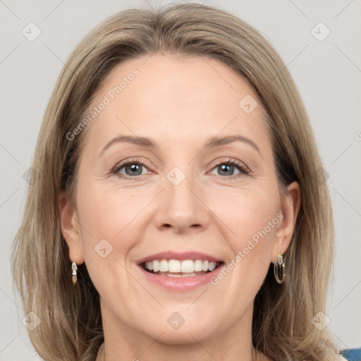 Joyful white adult female with medium  brown hair and grey eyes