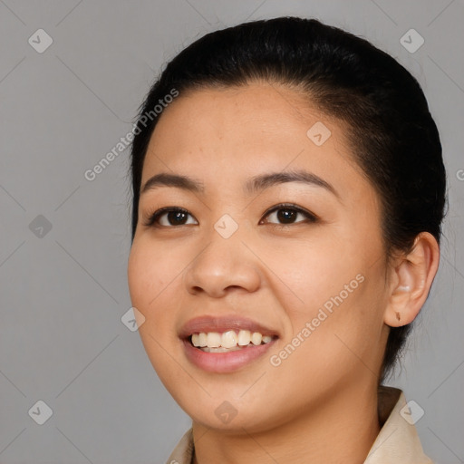 Joyful asian young-adult female with medium  black hair and brown eyes