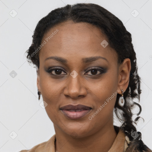 Joyful black young-adult female with long  black hair and brown eyes