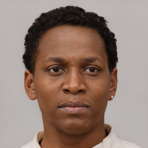 Neutral black young-adult female with short  brown hair and brown eyes