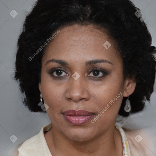 Joyful black adult female with short  brown hair and brown eyes