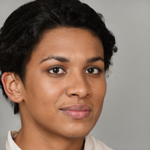 Joyful latino young-adult female with short  black hair and brown eyes