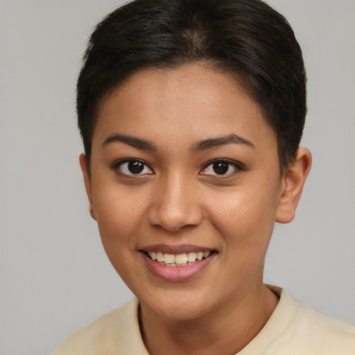 Joyful latino young-adult female with short  brown hair and brown eyes