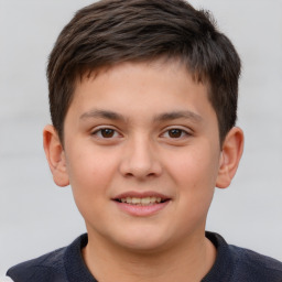 Joyful white child male with short  brown hair and brown eyes