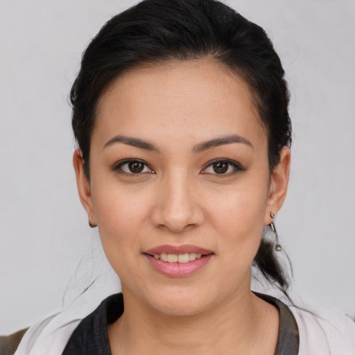 Joyful white young-adult female with medium  brown hair and brown eyes
