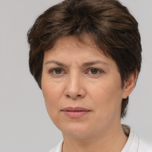 Joyful white adult female with short  brown hair and brown eyes