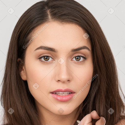 Neutral white young-adult female with long  brown hair and brown eyes