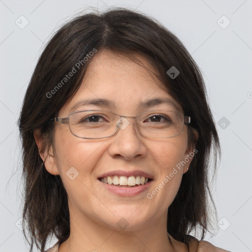 Joyful white adult female with medium  brown hair and grey eyes