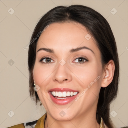 Joyful white young-adult female with medium  black hair and brown eyes