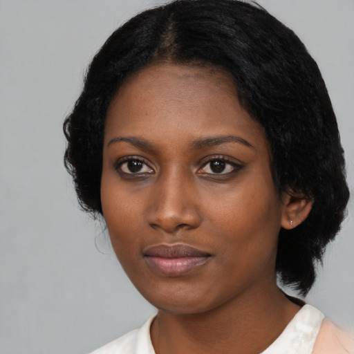 Neutral black young-adult female with medium  black hair and brown eyes