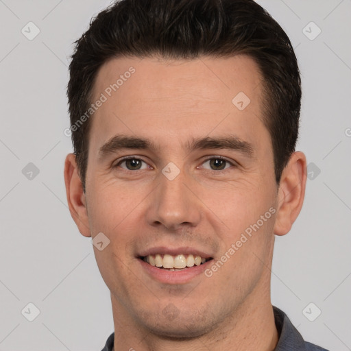 Joyful white young-adult male with short  brown hair and brown eyes