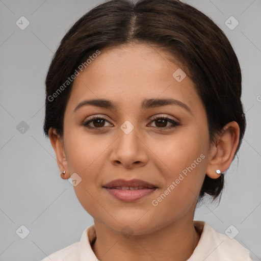 Joyful latino young-adult female with medium  brown hair and brown eyes