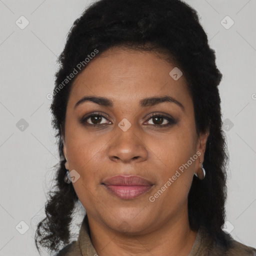 Joyful black adult female with short  black hair and brown eyes