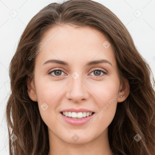 Joyful white young-adult female with long  brown hair and grey eyes