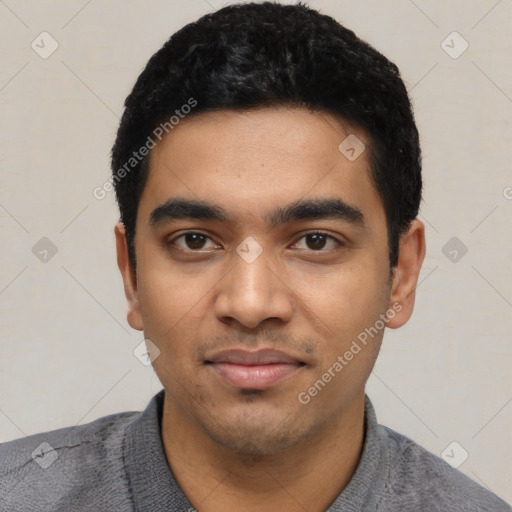 Joyful latino young-adult male with short  black hair and brown eyes