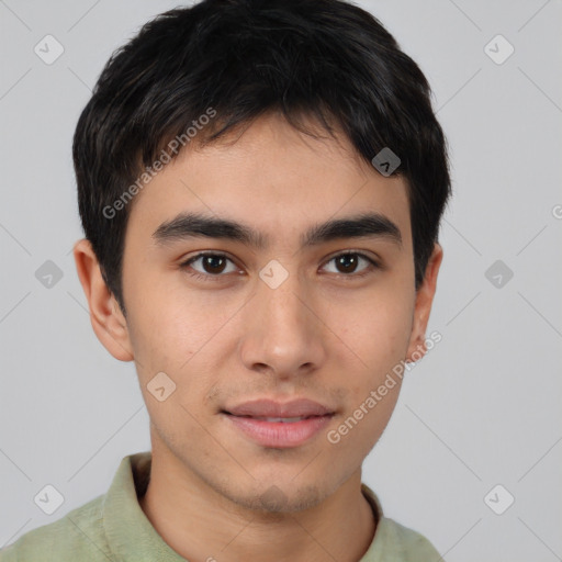 Joyful asian young-adult male with short  brown hair and brown eyes