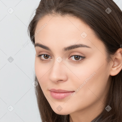 Neutral white young-adult female with long  brown hair and brown eyes