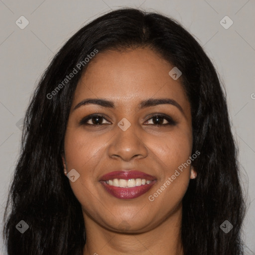 Joyful black young-adult female with long  brown hair and brown eyes