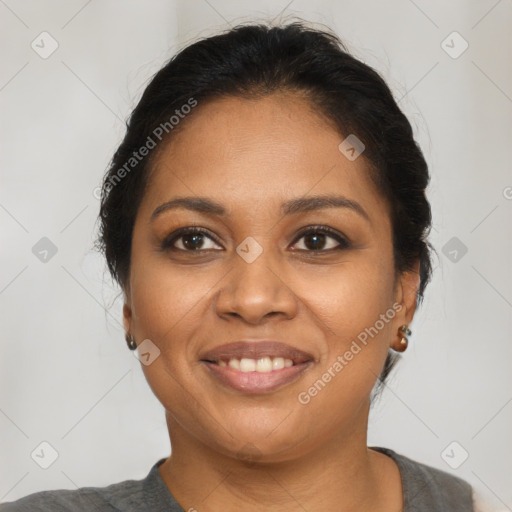 Joyful black young-adult female with medium  brown hair and brown eyes