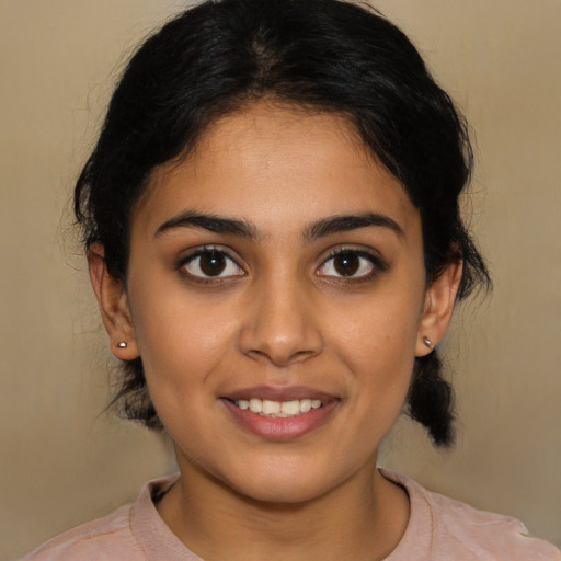 Joyful latino young-adult female with medium  black hair and brown eyes