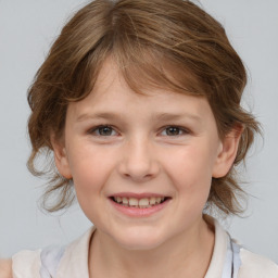 Joyful white child female with medium  brown hair and brown eyes