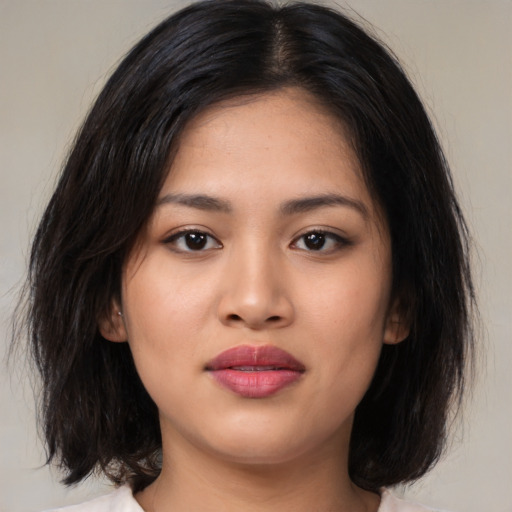 Neutral asian young-adult female with medium  black hair and brown eyes