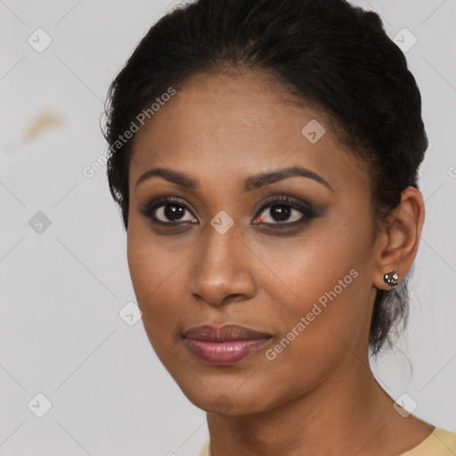 Joyful black young-adult female with short  brown hair and brown eyes