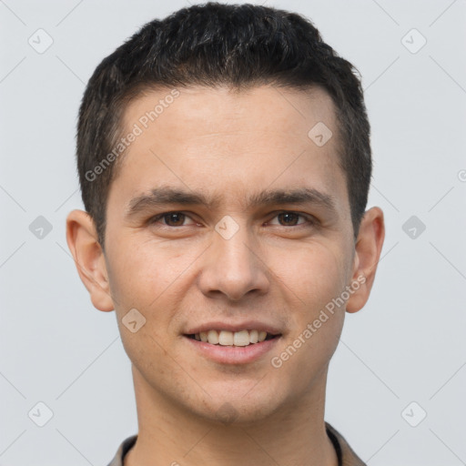 Joyful white young-adult male with short  brown hair and brown eyes