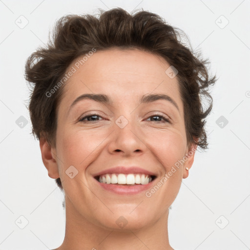 Joyful white adult female with short  brown hair and brown eyes