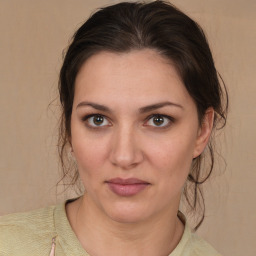 Joyful white young-adult female with medium  brown hair and brown eyes