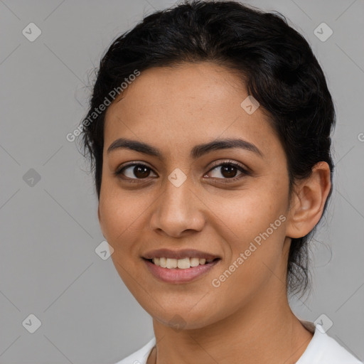 Joyful latino young-adult female with medium  brown hair and brown eyes