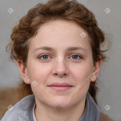 Joyful white young-adult female with medium  brown hair and blue eyes