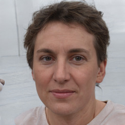 Joyful white adult female with short  brown hair and brown eyes