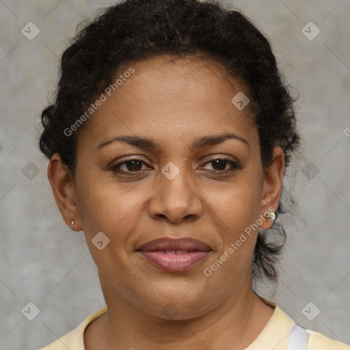 Joyful black adult female with short  brown hair and brown eyes