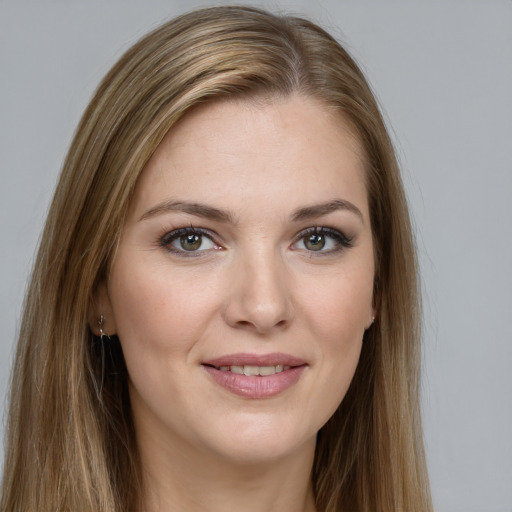 Joyful white young-adult female with long  brown hair and grey eyes