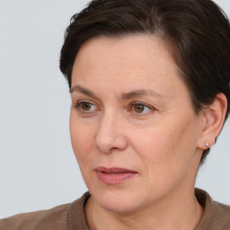 Joyful white adult female with short  brown hair and brown eyes