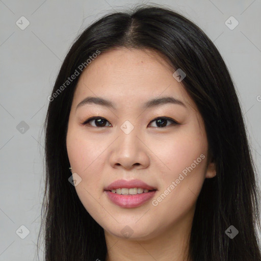 Joyful asian young-adult female with long  brown hair and brown eyes