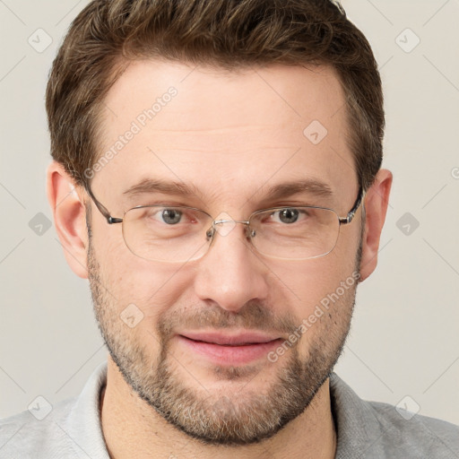 Joyful white adult male with short  brown hair and grey eyes