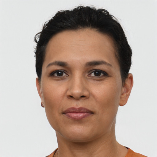 Joyful latino young-adult female with short  brown hair and brown eyes