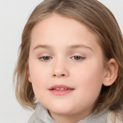 Joyful white child female with medium  brown hair and brown eyes