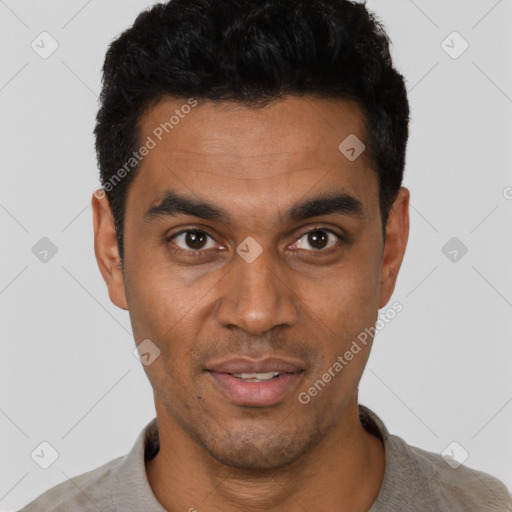 Joyful latino young-adult male with short  black hair and brown eyes