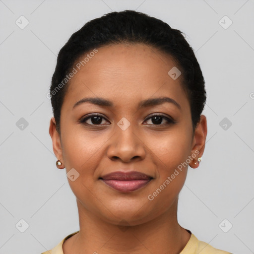 Joyful latino young-adult female with short  black hair and brown eyes